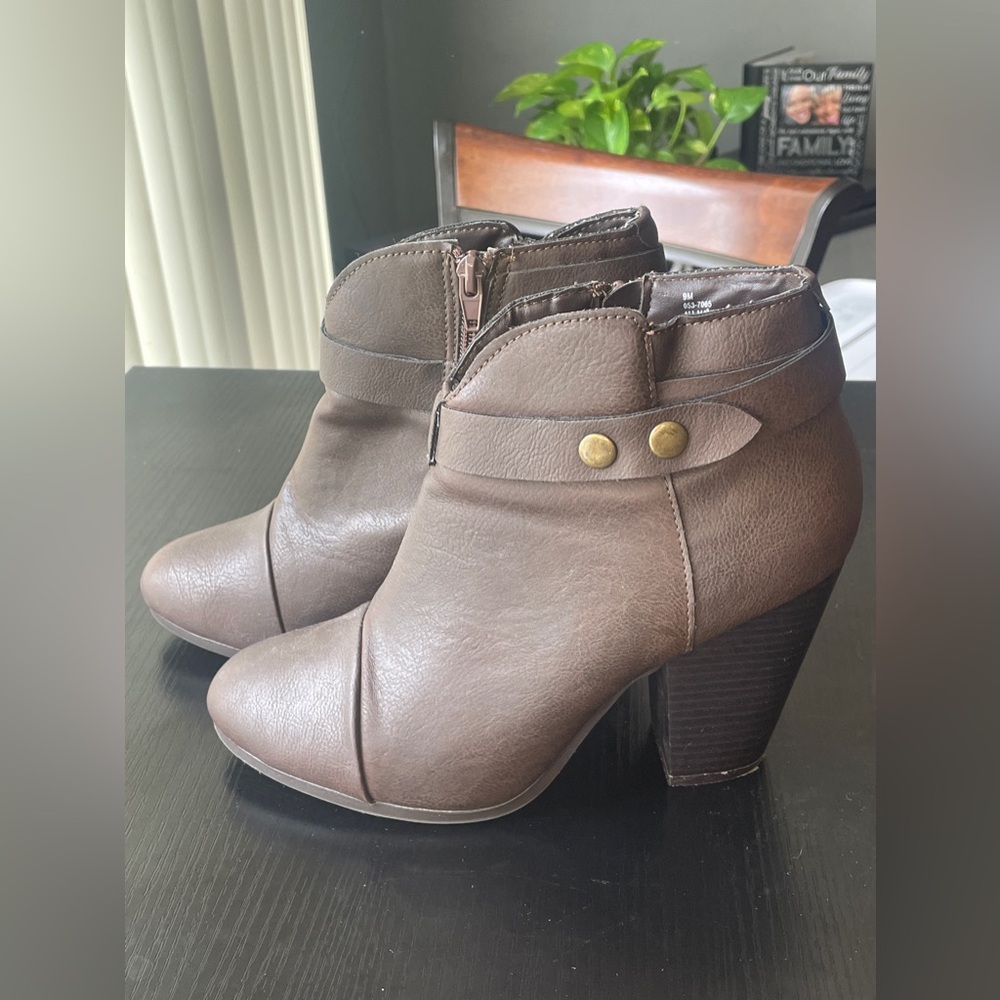 Brown, strapped buckle boots